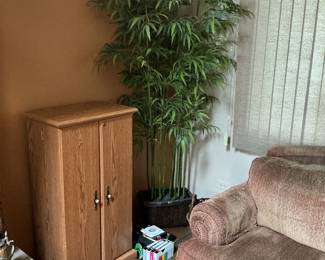 Artificial tree is 82” h x 40” w.  The oak VHS/CD cabinet measures 44” h x 14” d x 23” w.