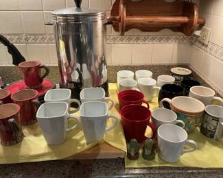 Cups and large serving coffee pot