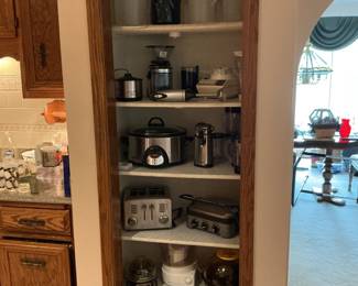 Shelves filled with small electrical appliances