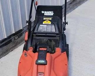 1 Black and Decker 36 volt cordless zero emissions lawn mower with bag. Needs battery