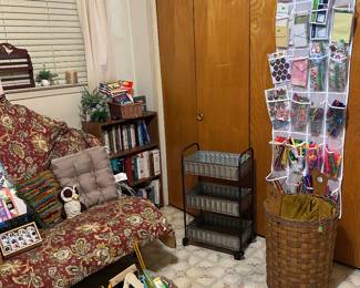 Adorable little metal cart, art/office supplies, books, another bookcase. 