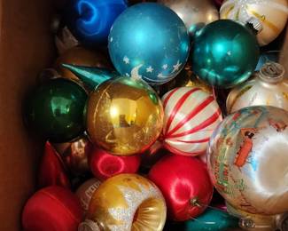 Variety of vintage and antique Christmas decorations.