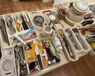Large assortment of kitchen gadgets and silverware