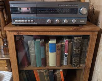 stereo cabinet and books
