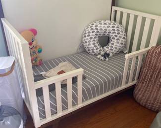 West Elm crib which converts to toddler bed as shown. We have 2!