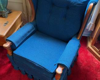 One of two matching vintage armchairs with striking blue upholstery, both in very good condition.