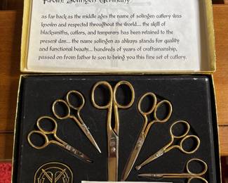 Vintage set of gold-handled scissors and shears by Heirloom Edition Cutlery set (Solingen, Germany).