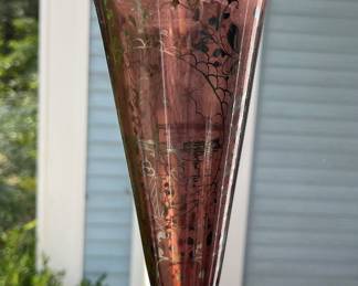 Vintage amethyst glass trumpet vase featuring intricate silver overlay.