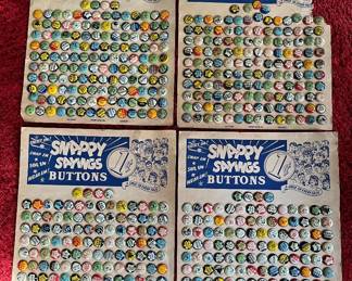 Four vintage 1940s "Snappy Sayings" pinback button display cards and salesman samples from the Green Duck Company.