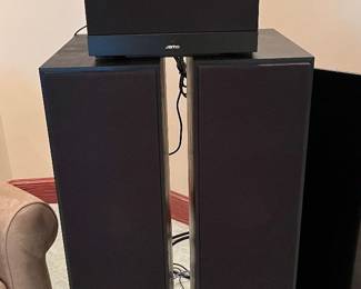 Pair of black floorstanding tower speakers by Klipsch; Jamo Sub 1810 subwoofer.