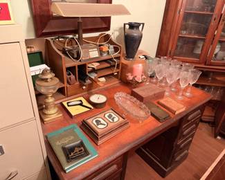 Lots of cool things to discover on top of vintage wooden desk