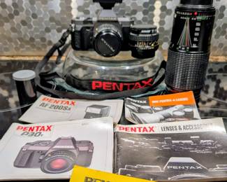 Pentax with two lenses and flash