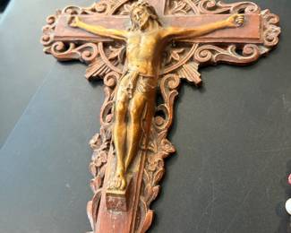 A last rites crucifix set (also called a sick call set) is a traditional Catholic wall crucifix that opens or slides apart to reveal a hidden compartment containing devotional items used by a priest to administer the Anointing of the Sick or Holy Communion