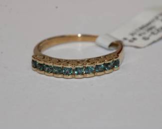 14 KT yellow gold Alexandrite ring that features 10 round alexanderites that weigh 0.58 CTW. Ring is new old stock with tag. it is a size 9 sizeable and weighs 2.8 grams. Very nice, rare gemstone ring.