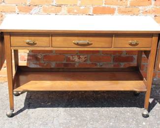MCM Cerama by Broyhill walnut serving cart/bar Mid century modern with off-white formica top. The sides drop down and expand easily to suit your needs. Some light scuffing/scratching from age appropriate wear.