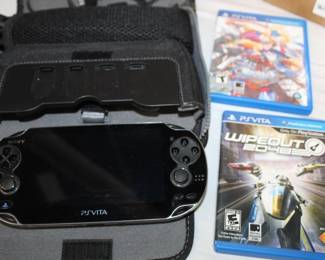 Sony Playstation PS Vita w/ case & power cord model PCH1101, comes w/ games; Blazeblue & Wipeout 2048 (has cigarette smoke smell)