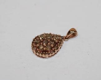 14 KT yellow diamond pendant that feature approx. 1.5 CTW of round yellow diamonds in teardrop shaped pendant. Hallmarked 14 K XX. diiamonds are prong set and pendant weighs 2.4 grams