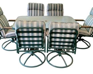 67 - 6pc Outdoor Patio Set w/ cushions (Description): Green Metal/Glass Top Table w/ Swivel Chairs w/ Cushions Table - 27.5 x 60.5 x 38.25 Chairs - 40 x 24 x 30