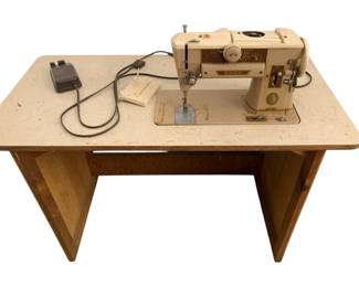 746 - Singer Sewing Machine w/ table (Description): 38 x 41.5 x 20.5 Used as is electric/electronic/mechanical item. No guarantee all components, untested.