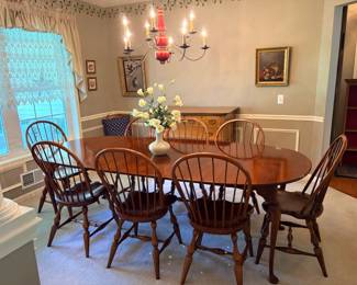Cherry dining room table (set up with leaves in) with 8 bentwood style chairs.
