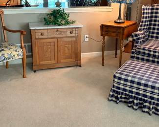 Marbletop dresser, drop leaf small side table next to reupholdered chairs.