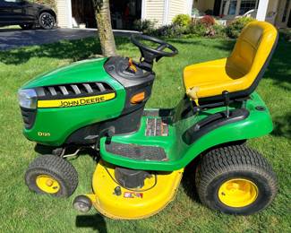 John Deere 42" mower with 338 hours and lawn sweeper.