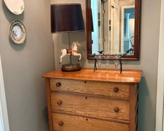 One of several mirrors, dressers, and lamps.
