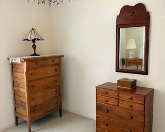 one of many lamps, 2 of many dressers, and one of many mirrors.