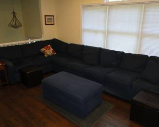 Large Denim Sectional 13 1/2 feet x90" Can be separated. Sleeper sofa in center, storage ottoman
