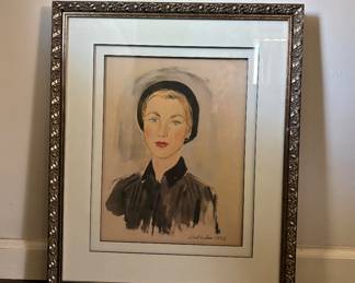 Lisel Salzer – Portrait of a Woman, 1952  Elegant original portrait by Austrian-American artist Lisel Salzer (1906–2005), signed and dated 1952. A beautifully composed mid-century portrait featuring a sophisticated female sitter, presented in an ornate metallic frame.  Salzer was an Austrian-born artist who established her career in the United States and has a documented museum and exhibition history.  Signed “Lisel Salzer 1952.”