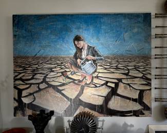 Robert Lebsack – “Mutually Beneficial”  Large-scale original mixed-media artwork by contemporary artist Robert Lebsack. The composition depicts a solitary woman watering a single red flower in a vast, cracked landscape, set against a striking blue background layered with newspaper and text elements. Expressive, thought-provoking and visually dramatic, the piece combines figurative imagery, collage and rich surface texture.  Original mixed-media artwork, signed by the artist. Sold individually.