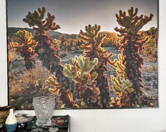 Large Framed Joshua Tree Fine Art Photograph  Striking large-scale fine art photograph capturing the dramatic desert landscape of Joshua Tree National Park, with cholla cacti beautifully illuminated by the warm setting sun.  The large format and atmospheric desert light give the piece a wonderful sense of depth and presence. Presented in a sleek contemporary frame and ready to display.  Fine art photography. Sold individually. Please message for dimensions, additional photos or information.