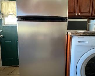Whirlpool Stainless Steel Refrigerator  Whirlpool refrigerator featuring a classic top-freezer design with a sleek stainless-steel finish. Spacious, practical and versatile, with separate freezer and refrigerator compartments.  A great full-size refrigerator for a kitchen, apartment, rental property or secondary refrigerator.  Sold individually. Buyer responsible for pickup and removal.