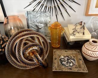 Signed Infinity Rope Art Glass Sculpture  Striking sculptural art glass piece featuring an intricate infinity-rope design, formed from multiple twisted loops of clear, amber and deep-toned glass. The complex intertwined form creates beautiful movement, depth and reflections from every angle.  Signed “Z.” Artist currently unidentified.  A substantial decorative statement piece and a beautiful example of contemporary art glass.  Sold individually.
