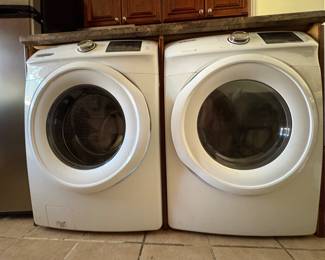 Samsung Front-Load Washer & Dryer Set  Matching Samsung front-load washer and dryer set in white, featuring modern digital controls and large-capacity drums.  A practical matching laundry set with a clean, contemporary design.  Sold as a set.