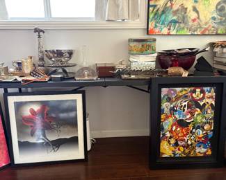 Framed Art Prints – Disney & Limited Edition  A selection of distinctive framed art prints available at the sale, including a colorful Disney character print featuring an original Goofy sketch on the reverse, as well as a striking signed and numbered limited-edition surrealist print featuring a red flower in motion.  Both pieces are beautifully framed and available individually.