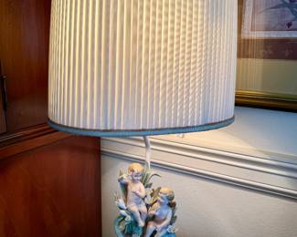 Vintage porcelain lamp featuring cherubs