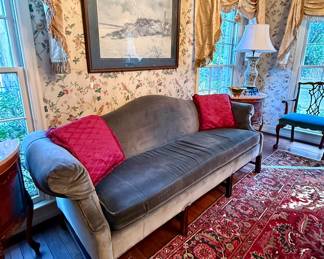 Sumptuous velvet camel-back sofa