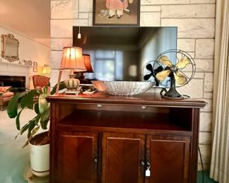 Media console and antique fan