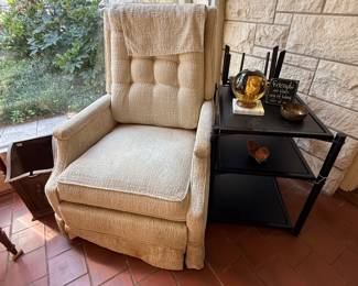 Kick back in this swivel recliner