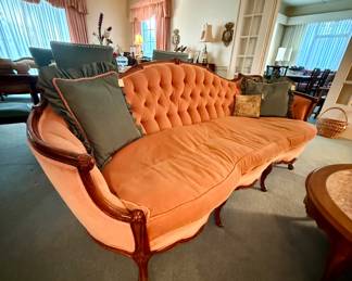 Iconic vintage Victorian Revival tufted sofa