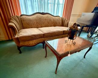 Vintage three-cushion sofa with ornately carved frame