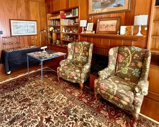 Check out is in the den where you’ll find beautiful upholstered chairs and matching drapery
