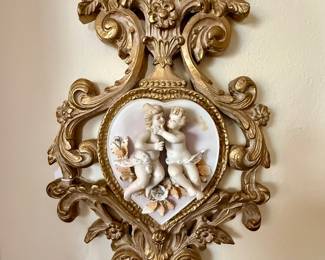 One of a pair of Rococo-style wall plaques