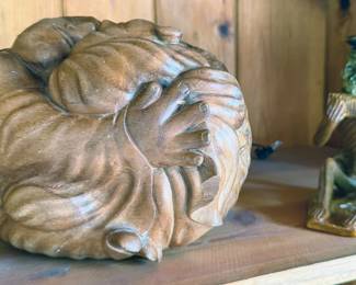 Wood carved figurine of two bodies embracing