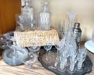 Assorted stemware + cut crystal decanters