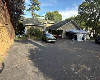FRONT ENTRANCE: sheds to the left have items for sale as well as the tents.