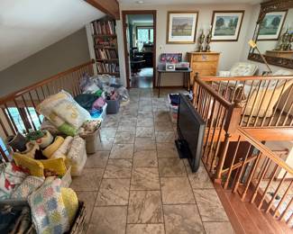 UPSTAIRS: turn right for bedroom with clothes and hand painted folk art.