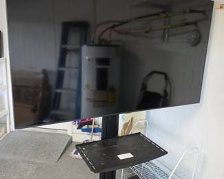 Large TV on a rolling stand 