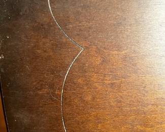 #104 Wood veneer Half-Moon Table w/scallop carved top and Bottom Shelf - (chip on top and wear on bottom) - 30x15x32 $75.00